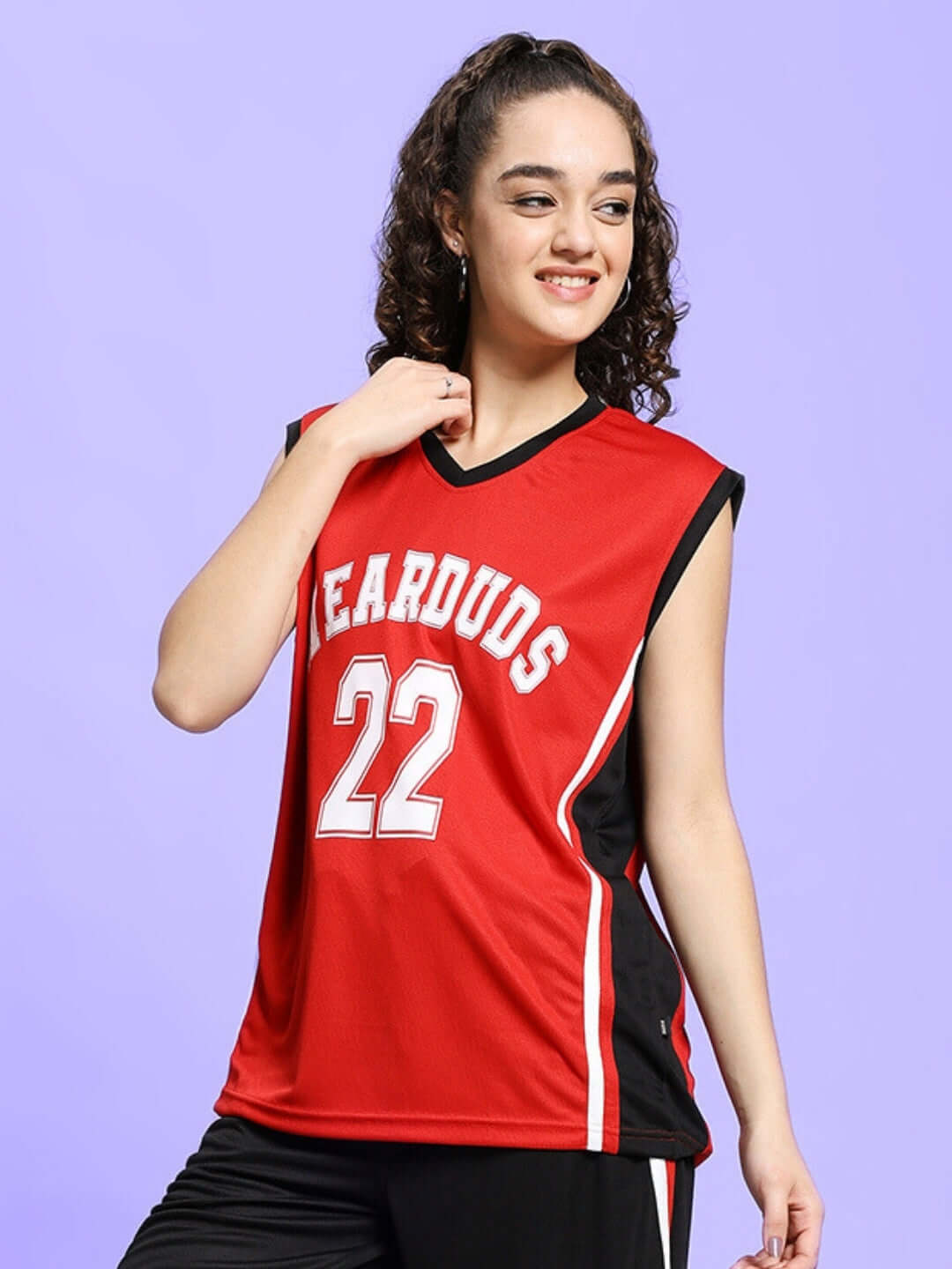 Woman wearing a red Portia gym T-shirt with custom fit option by Duds, featuring jersey number 22 and stylish sleeveless design.