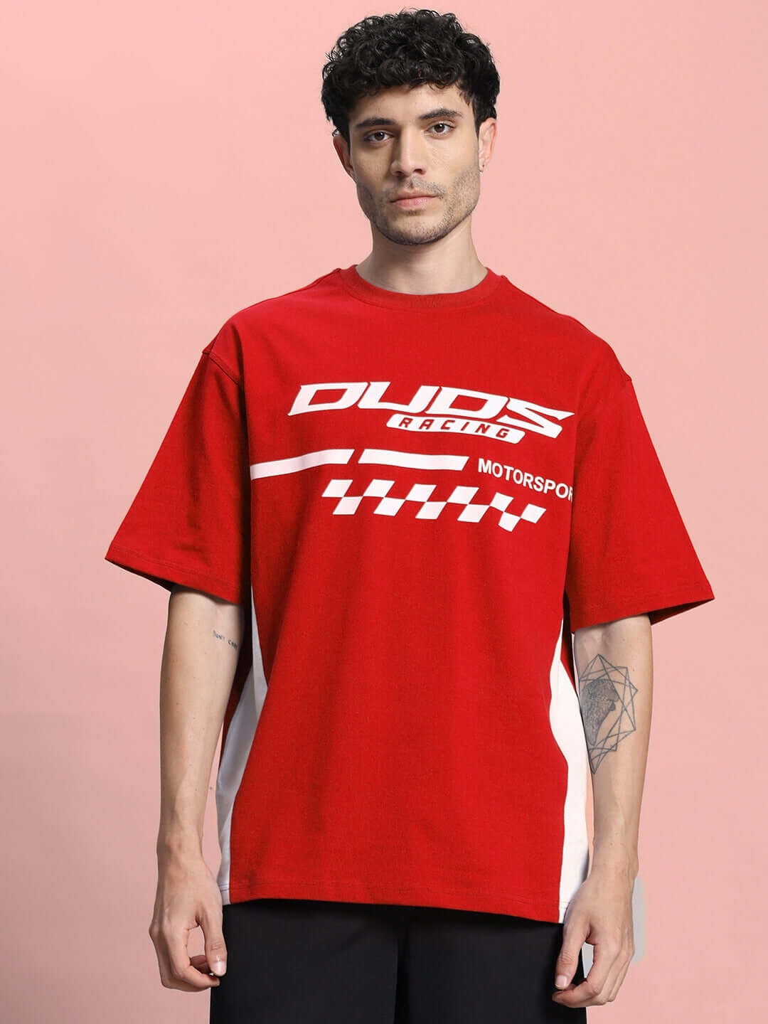 Man wearing red oversized classic t-shirt with racing design, made from premium 97% cotton and 3% elastane, ideal for a casual look.