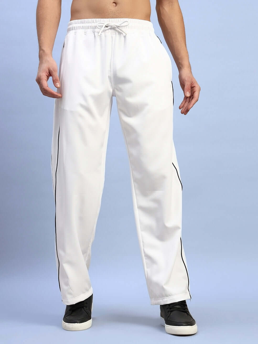 White RELIGHT relaxed-fit joggers for men, featuring a customizable fit option for prepaid orders, shown on a blue background.