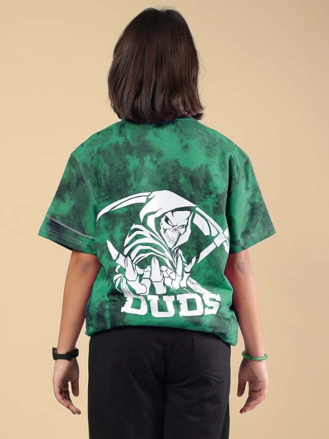 Boy wearing green tie-dye Ghost Rider t-shirt with graphic, made by DUDS, available for boys and girls, customizable sizing.