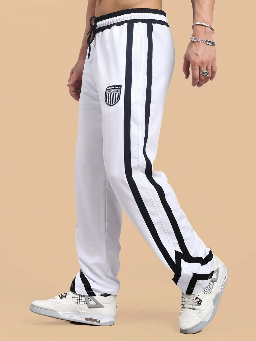 FRIZZLE Relaxed Fit Jogger in white with black stripes, made-to-order by DUDS, shown on a model with sneakers.