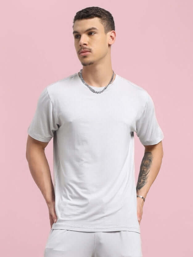 Man wearing grey Amble T-shirt made from premium heavy gauge fabric, ideal for stylish comfort. Bio-washed modal, made in India.