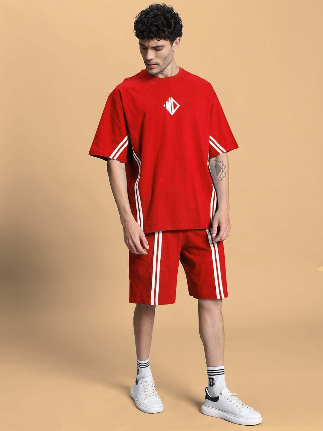 Red summer co-ord shorts set with premium cotton fabric, displayed on a model, featuring white stripe detailing. Ideal for casual wear.