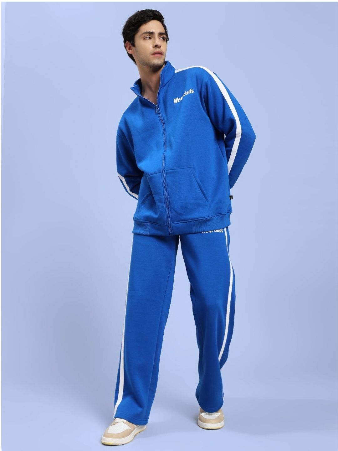 Man wearing RAPID STRIDE ROYAL BLUE COTTON FLEECE CO-ORD SET with white stripe detail, showcasing stylish and comfortable activewear.