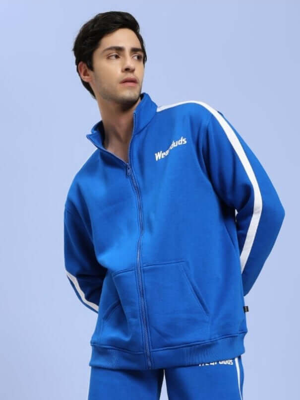 Model wearing Rapid Stride Cotton Fleece Jacket Royal Blue, showcasing sporty style and comfort for active adults.