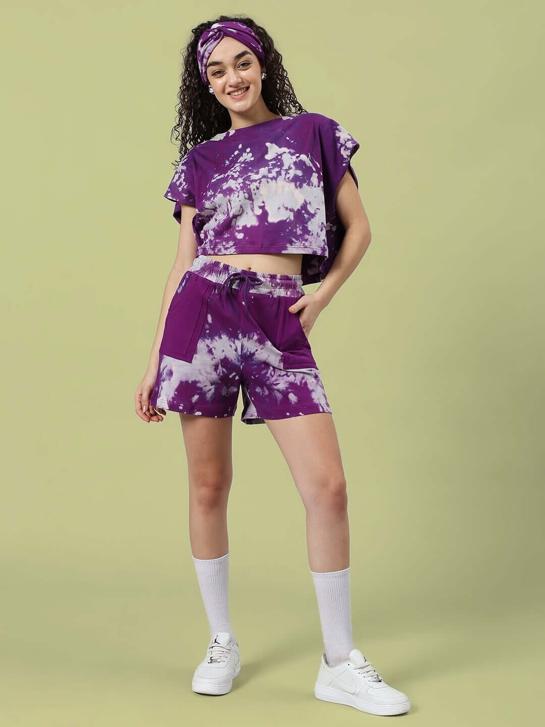 Purple tie-dye women's co-ord set with shorts and top, made of premium cotton and elastane blend, modeled with confidence.