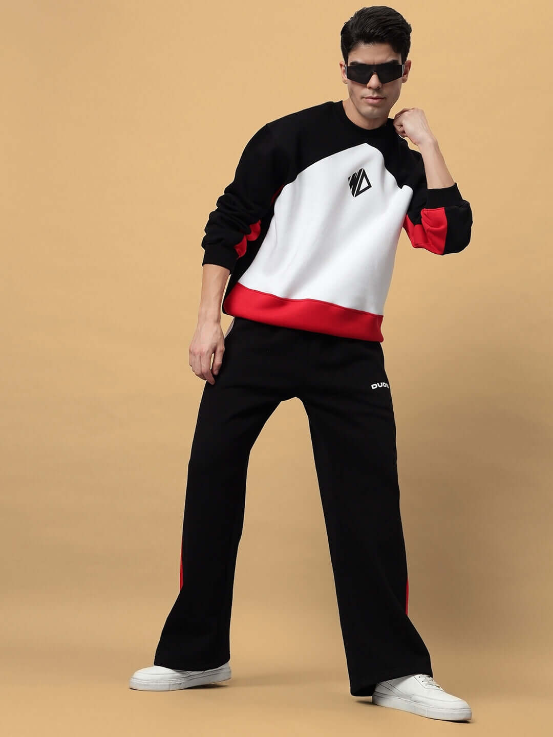 Model wearing WD Fervid Colorblock Fleece Cargo Pant in black, showcasing bold casual style and comfort with colorblock design.