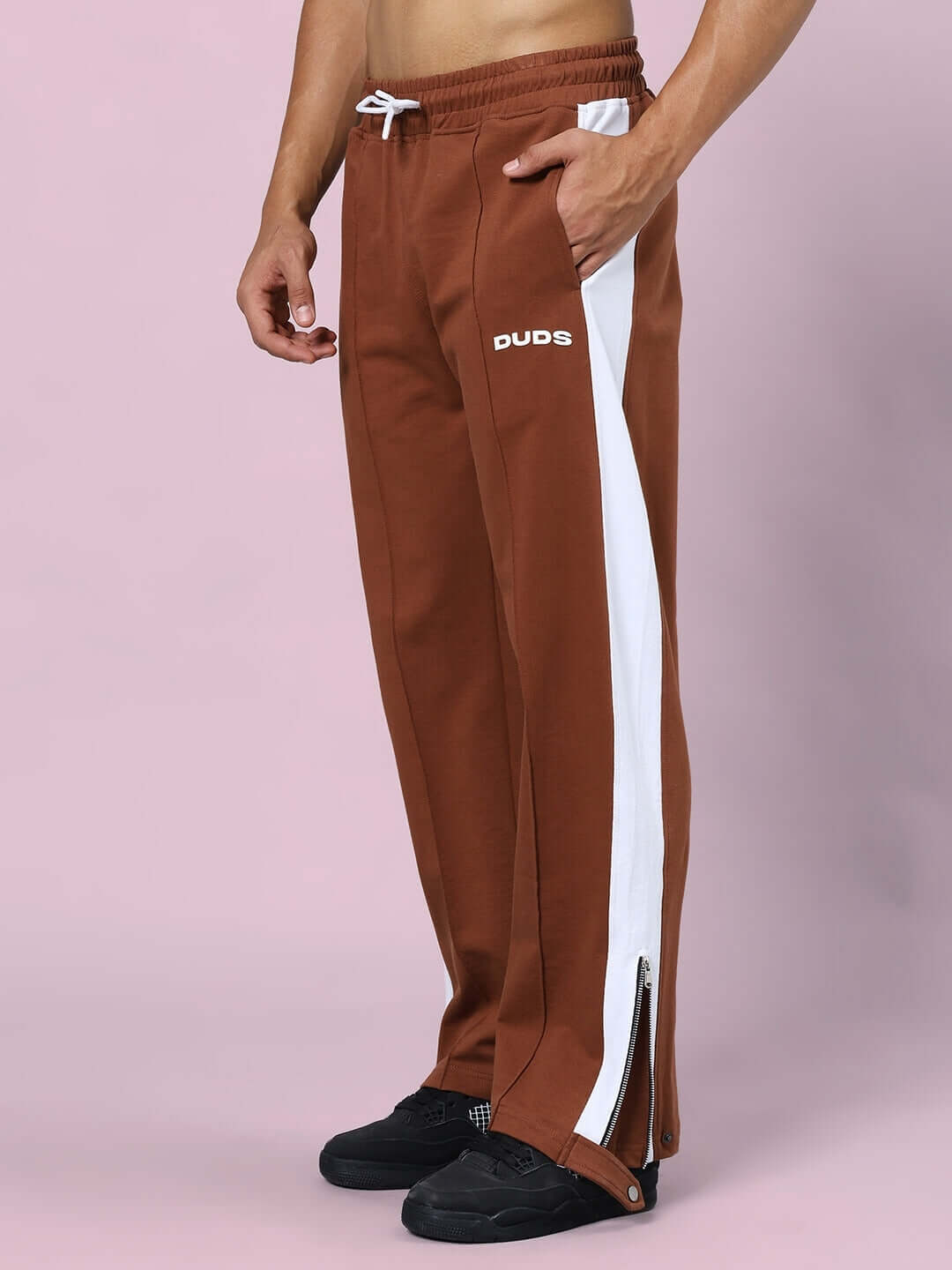 Brown Wonder Slit Zipper Joggers by DUDS with custom fit option, featuring white side stripes and adjustable waistband.