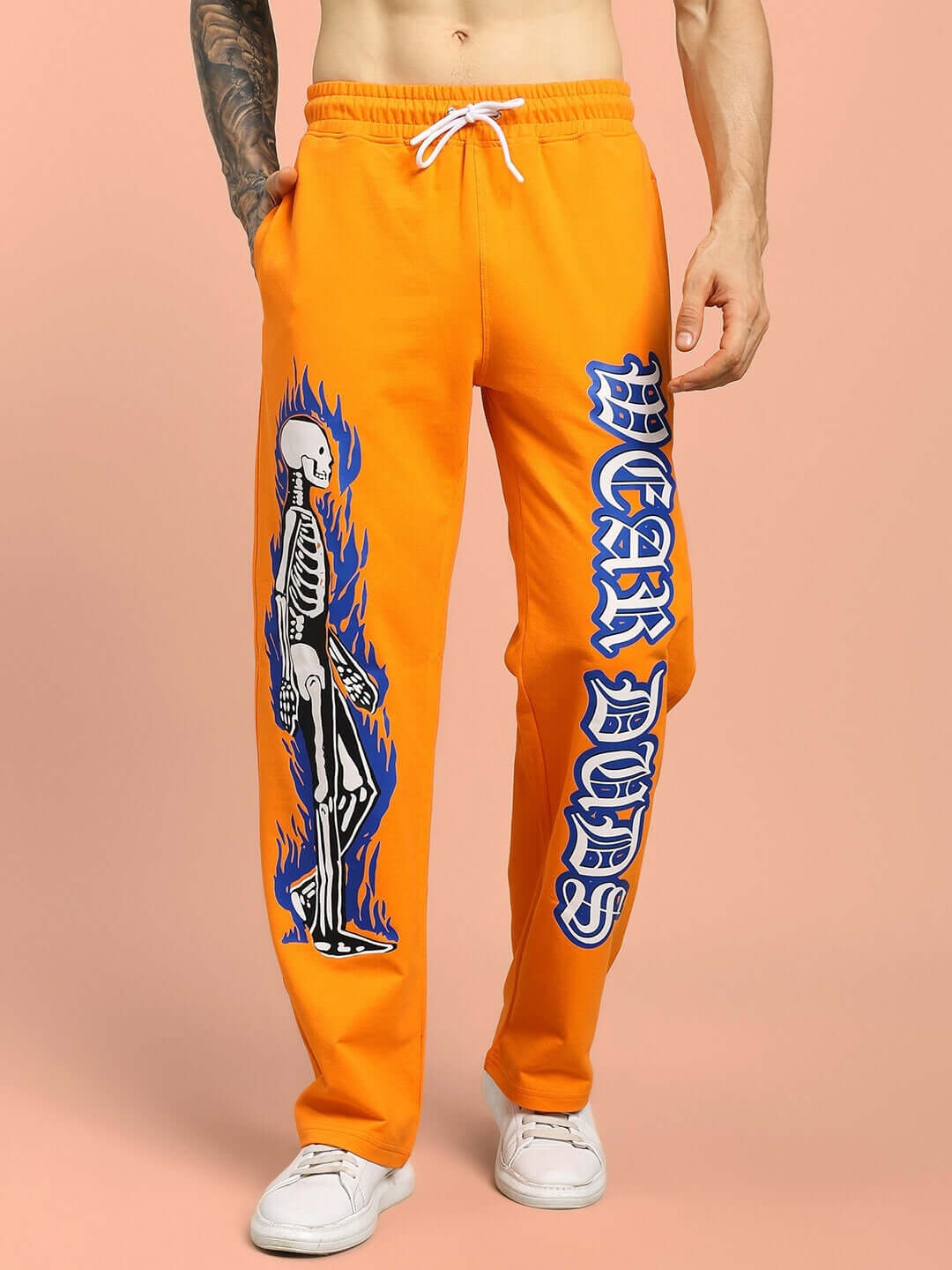 Flaming skeleton printed orange jogger with relaxed fit, custom size option available, made by experienced tailors at DUDS.