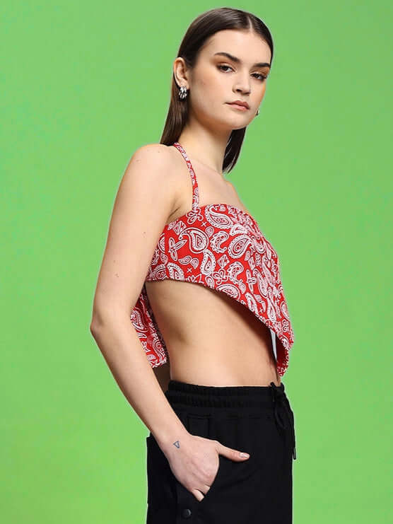 Model wearing Women's Ziva Crop-Top in red, made from 100% cotton premium heavy gauge fabric, against a green background.