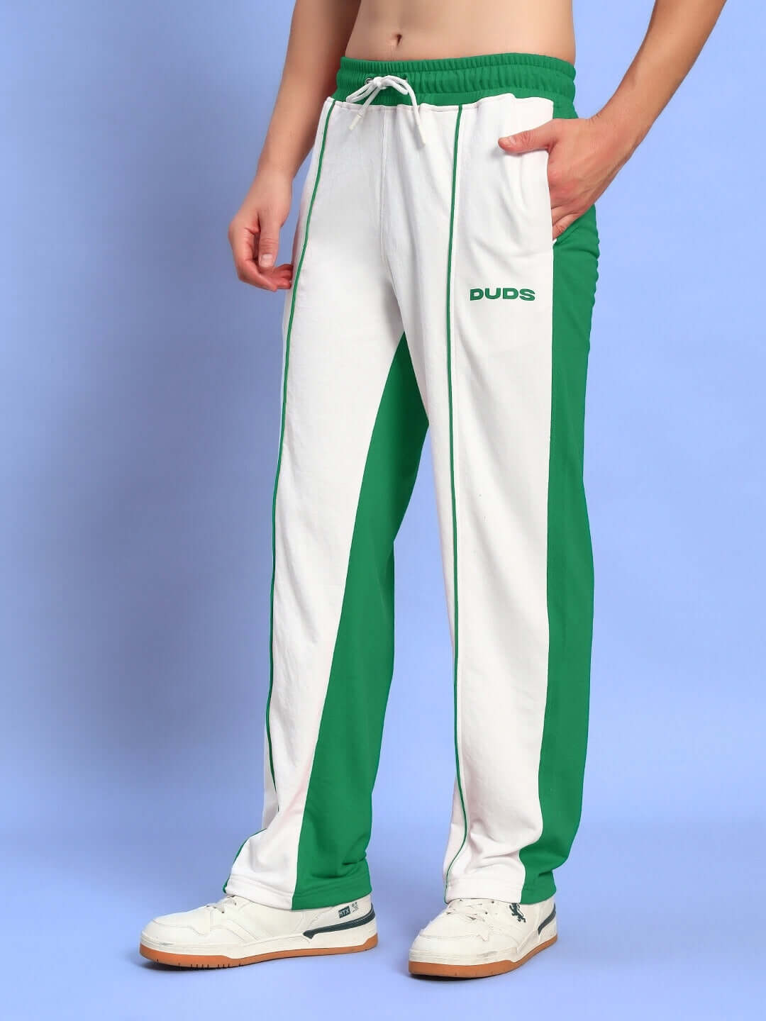 Person wearing Lagoon Relaxed Fit Joggers in white and green by DUDS.