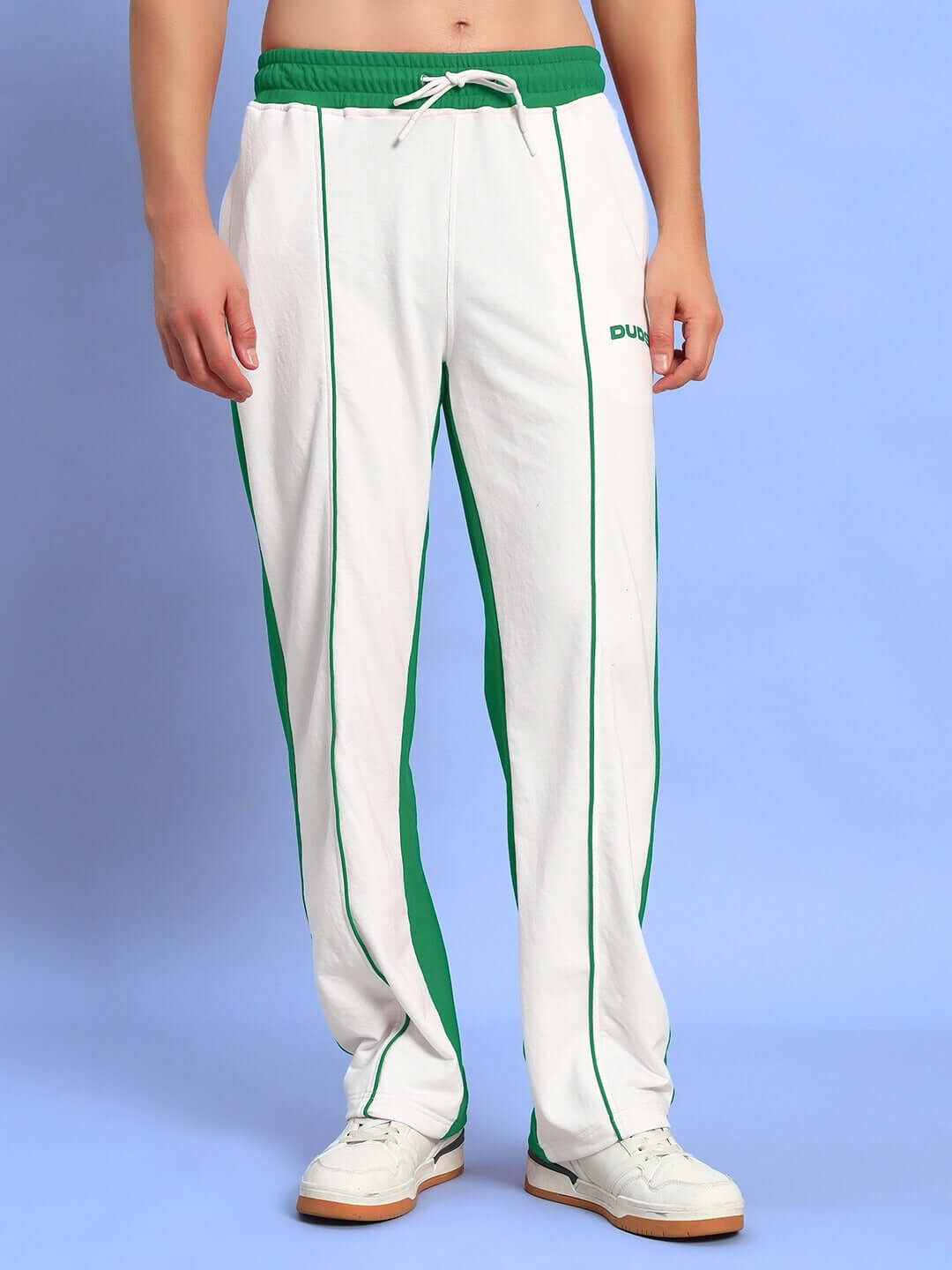 Model wearing Lagoon Relaxed Fit Joggers in white with green accents, showcasing casual and comfortable style.