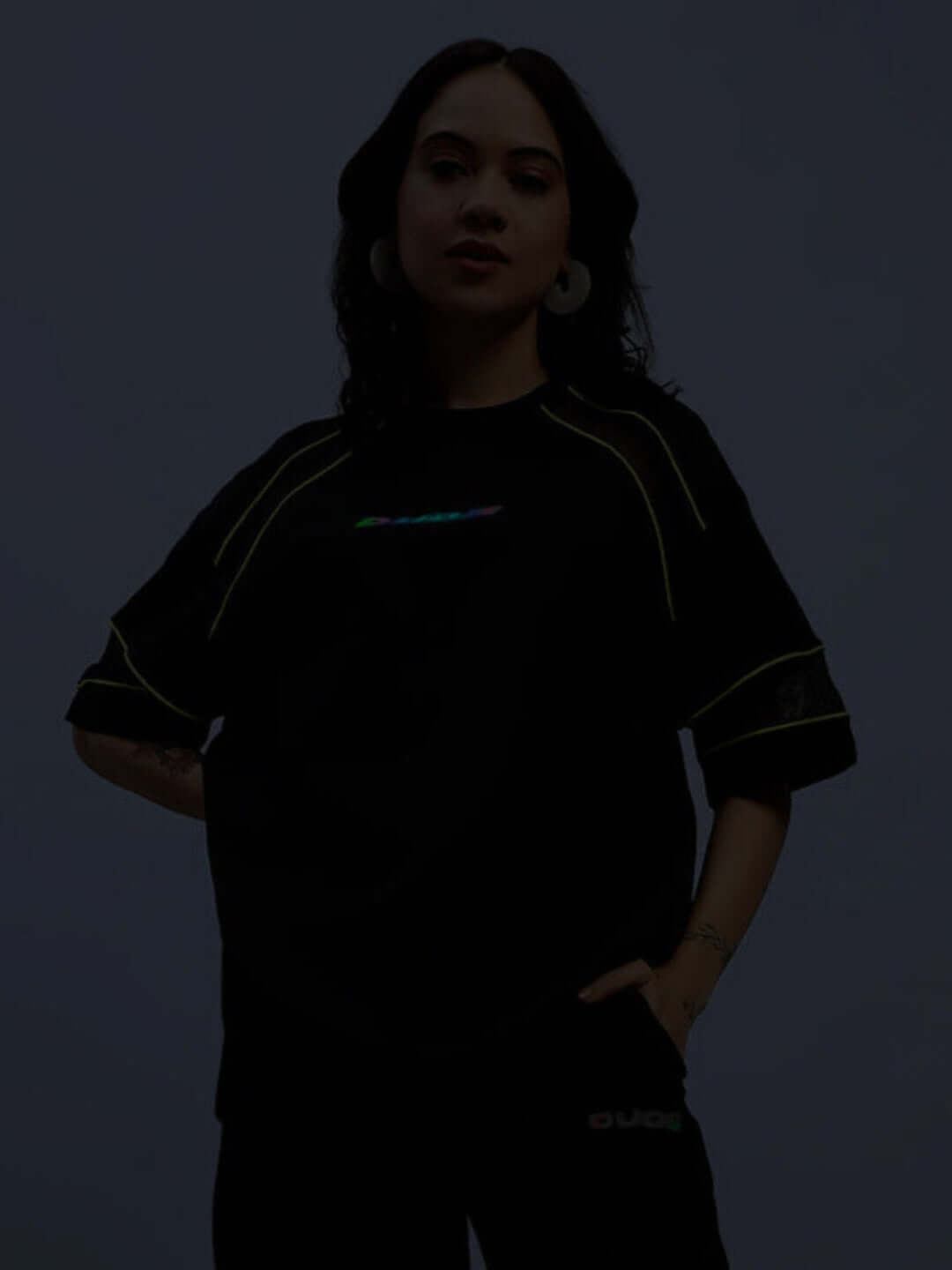 Model wearing Women's Salvo Regular Fit T-Shirt in black; crafted from sports polyester, ideal for casual and active wear.