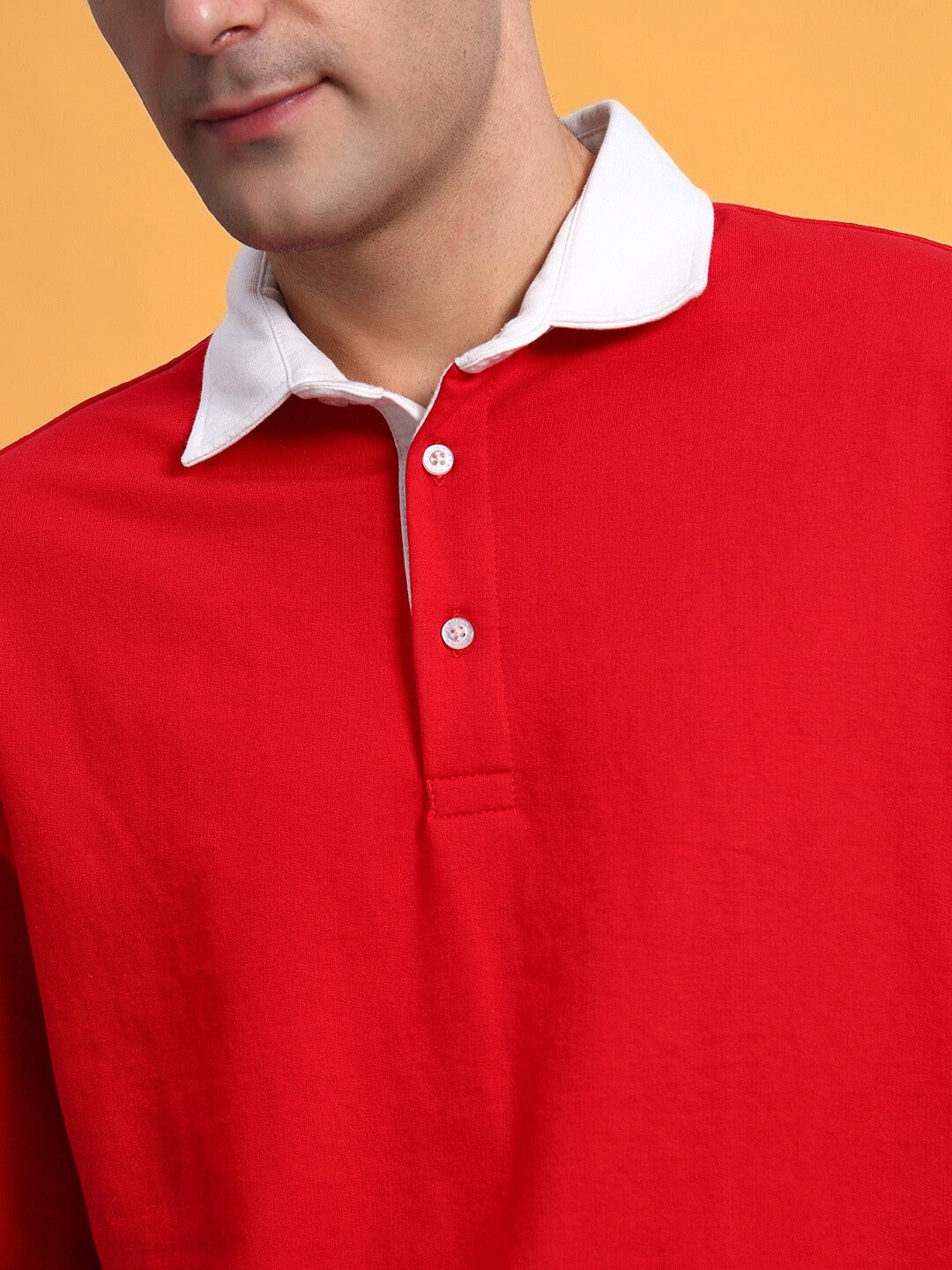 Person wearing red SAGOL Polo Oversized Sweatshirt with white collar, made of premium cotton French Terry Lycra, from India.