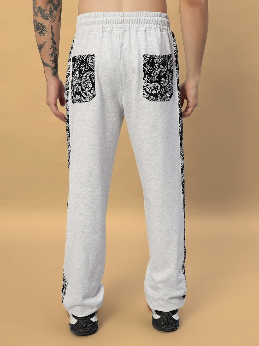 Back view of Boogie Relaxed Fit Joggers in melange grey with detailed black paisley pockets, designed for comfort and custom fit options.