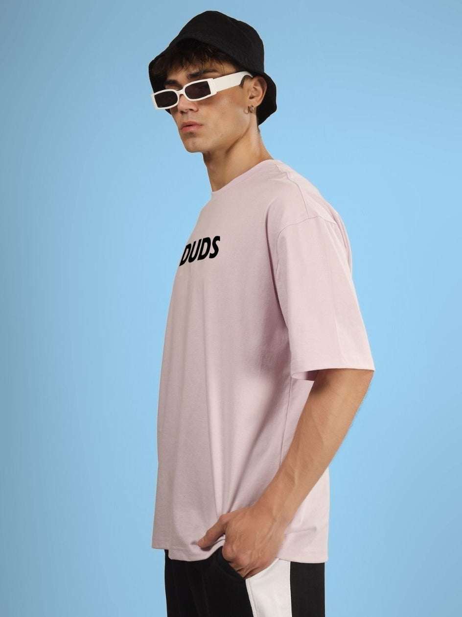 Person wearing STAY WILD OVERSIZED T-SHIRT GREY with sunglasses and hat, side view