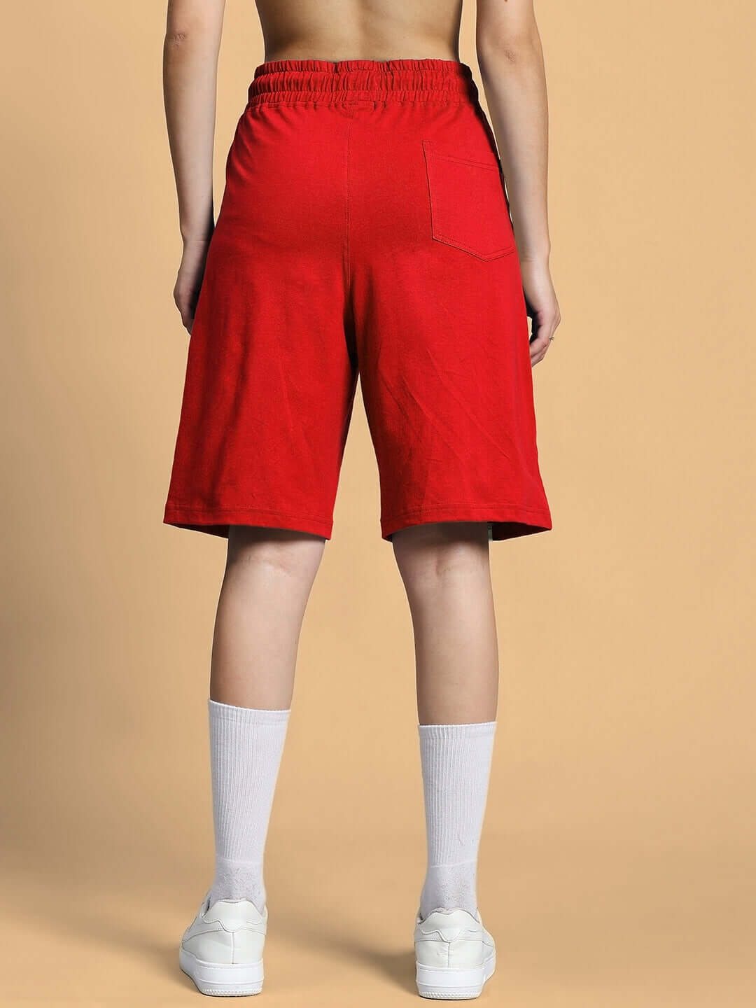 Women's red Outlook regular fit shorts, back view showcasing pocket design, suitable for custom fit options.