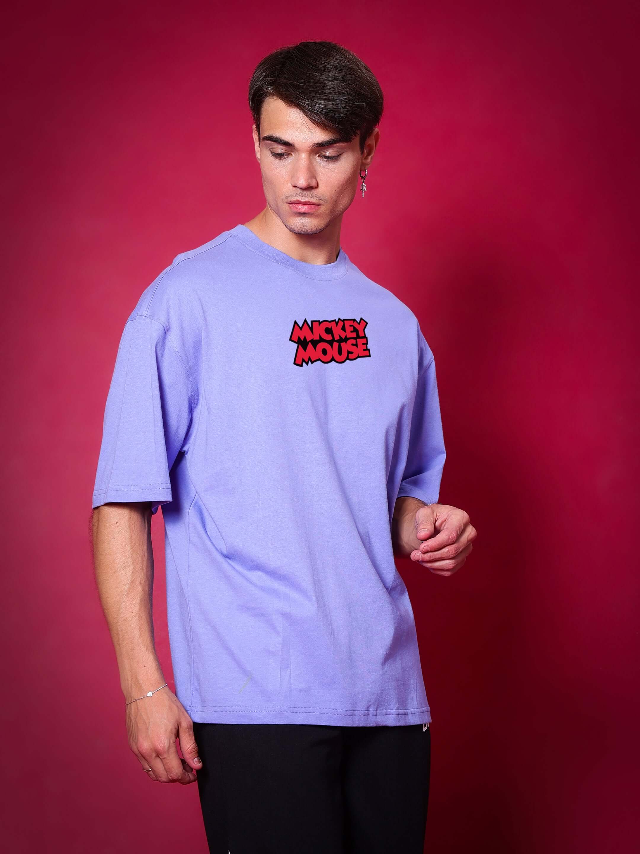 Man wearing DUDS MOUSE OVER-SIZED T-SHIRT PERIWINKLE with Mickey Mouse logo.