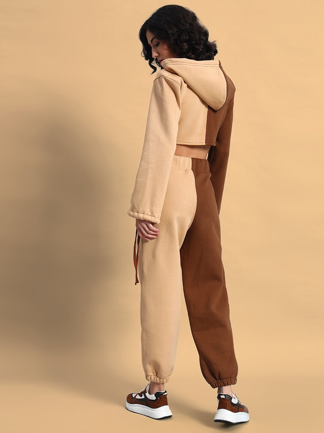 Model wearing WOMEN'S SOPHIA CO-ORD SET in beige-brown, showcasing the comfortable chic fit from behind.