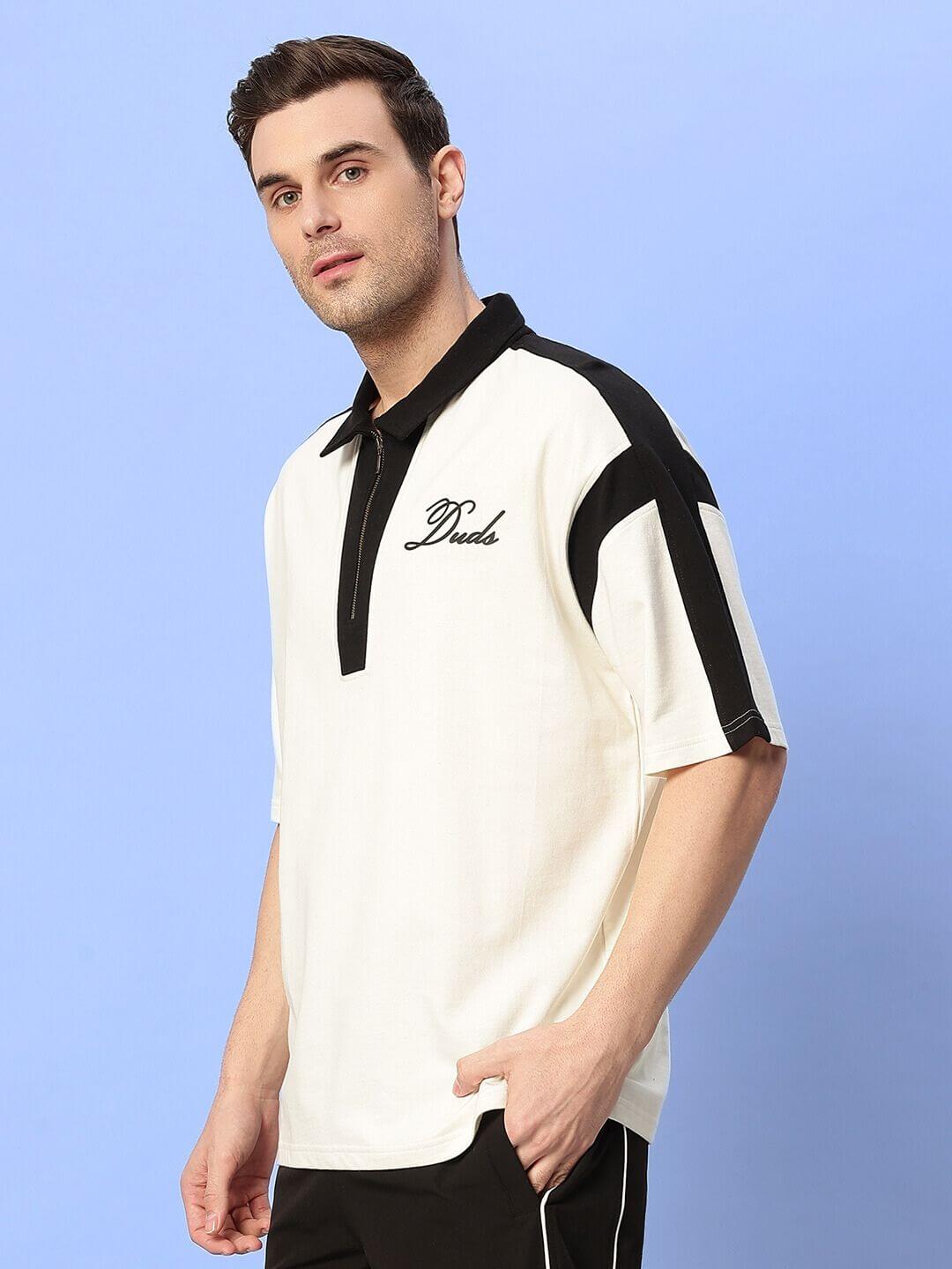 Model wearing MIKE POLO CLASSIC T-SHIRT in off-white, crafted from premium cotton French terry. Features a stylish polo design.