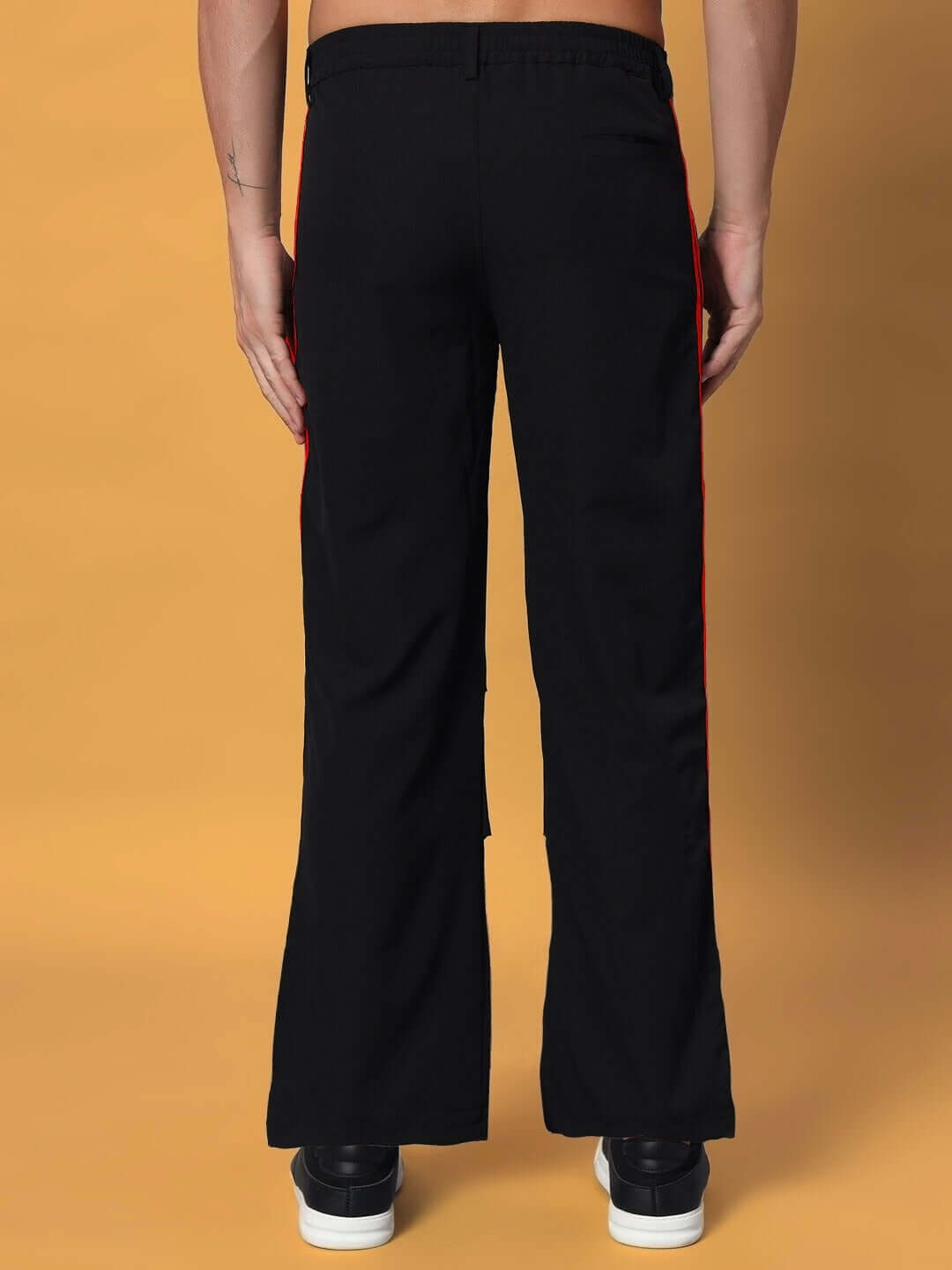 Back view of Drove Relaxed Fit Cargo Pants in black-red, showcasing stylish design and comfortable fit. Available in custom sizes.