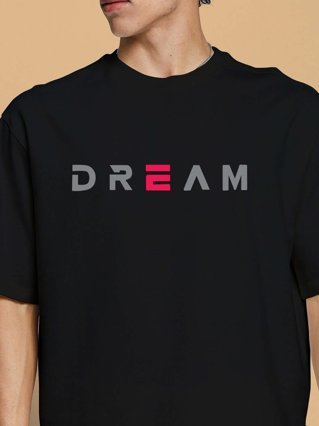 FANCY DREAM oversized black T-shirt, premium cotton blend, 'Dream' print, stylish casual wear. Manufactured in India.