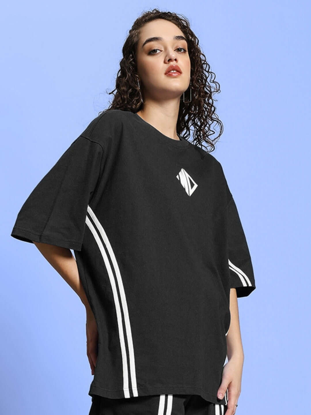 Model wearing Women's Outlook Over-Sized T-Shirt in Black, premium cotton fabric with elastane, featuring stylish oversized design.