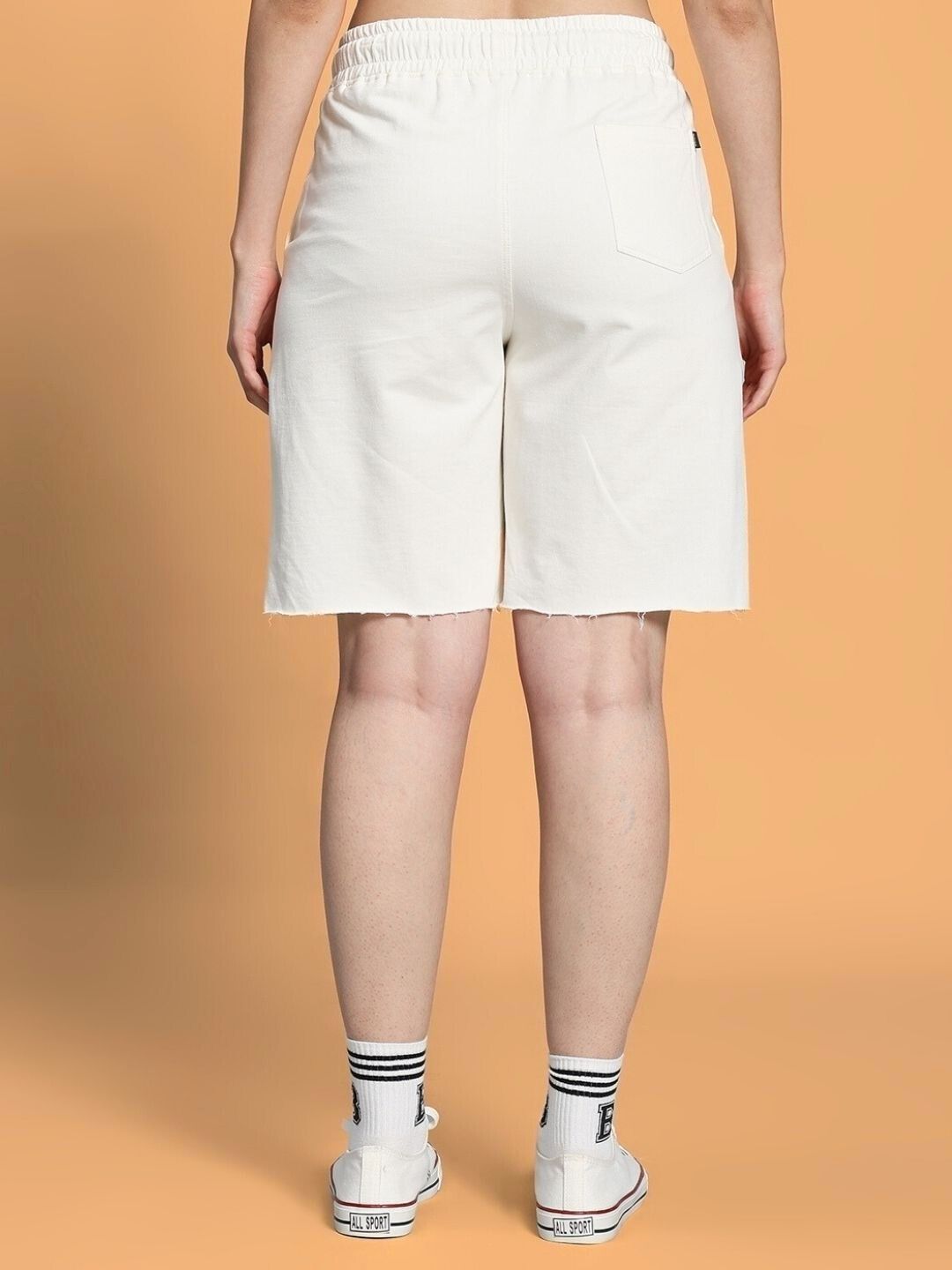 Back view of WOMEN CLOUD PRINTED RELAXED FIT SHORTS OFF WHITE, showcasing comfortable fit and soft fabric.