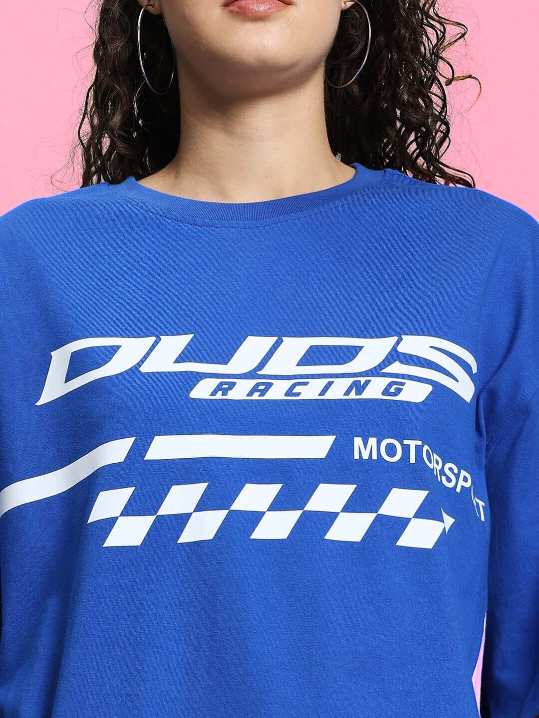 Model wearing women's Indy oversized classic T-shirt in royal blue with racing print, made from premium cotton and elastane blend.