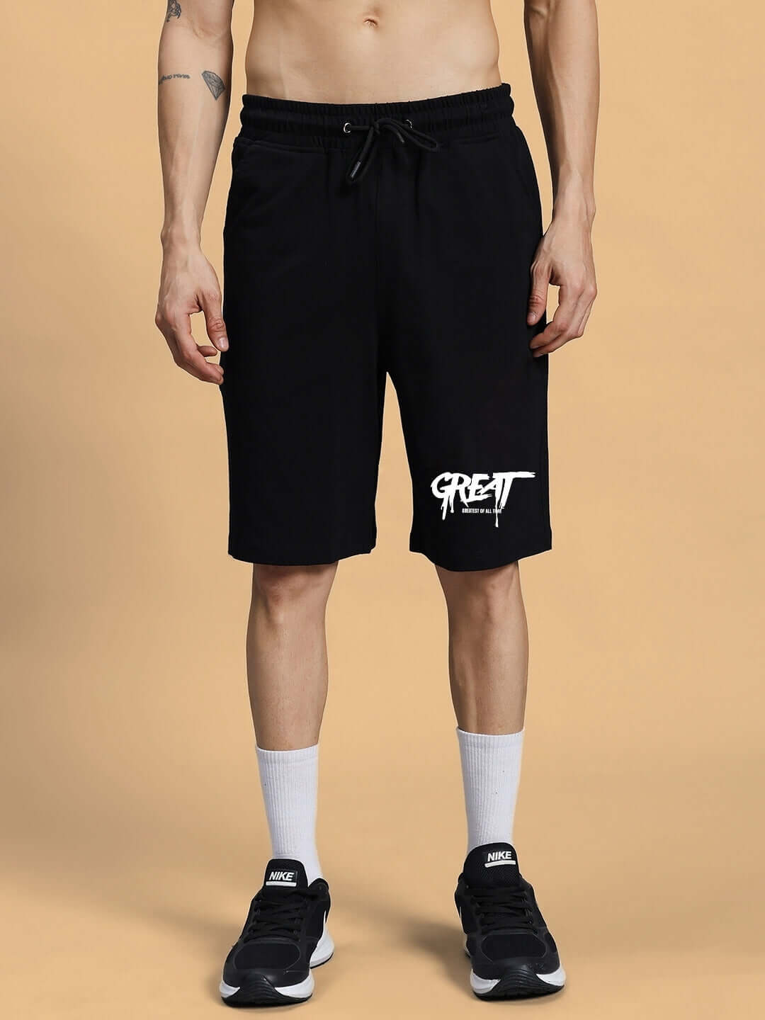 Black printed men's summer shorts with customizable fit option, shown on a model, featuring casual style and comfort.
