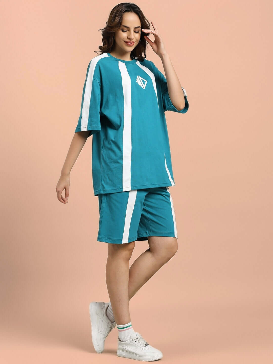 Woman wearing teal wideline summer co-ord set with white stripes, showcasing premium cotton fabric. Perfect for stylish comfort.