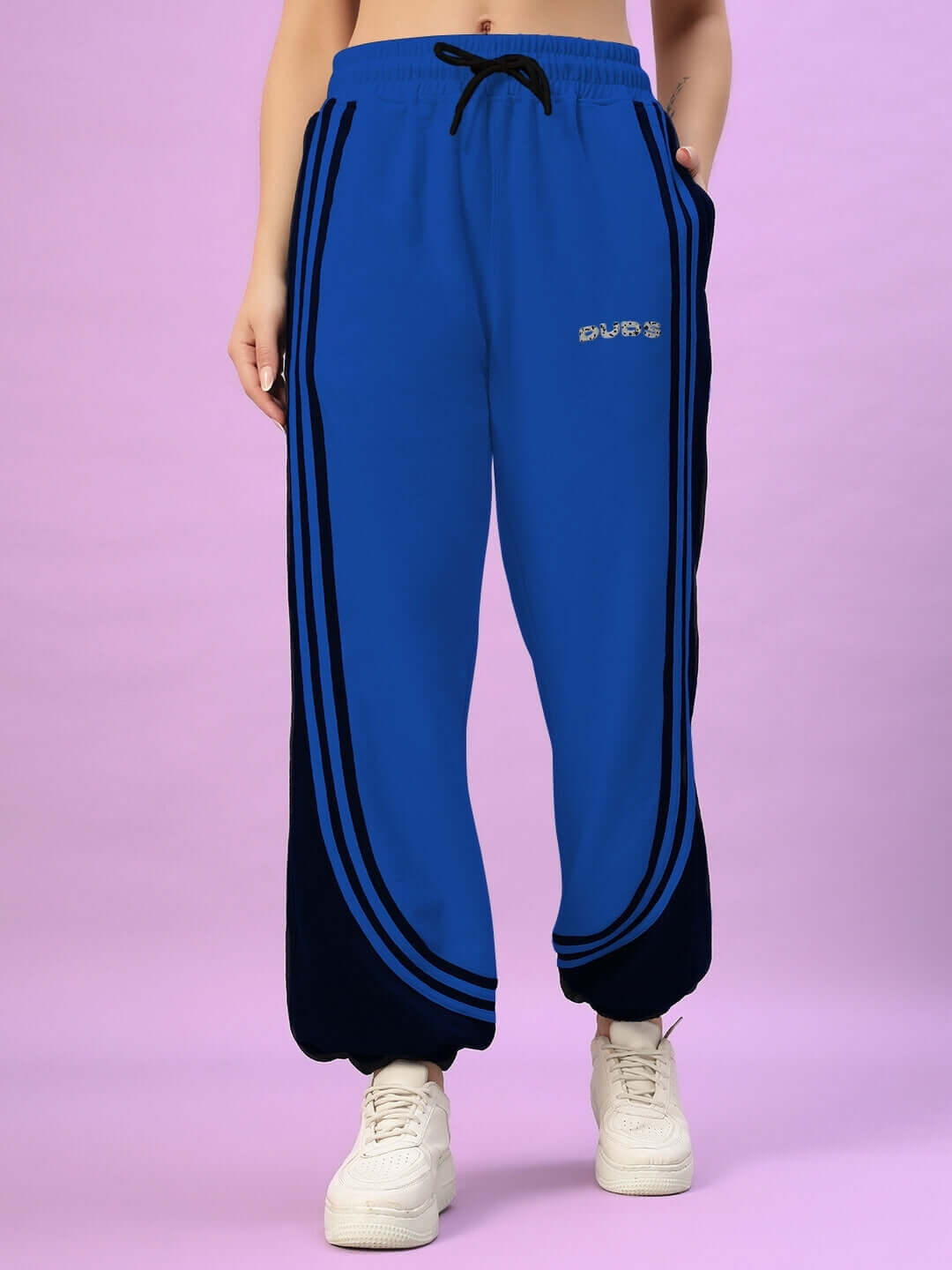 Blue and black women's joggers with contrast stripes, featuring custom fit options by DUDS. Made by experienced tailors, 7-10 day dispatch.