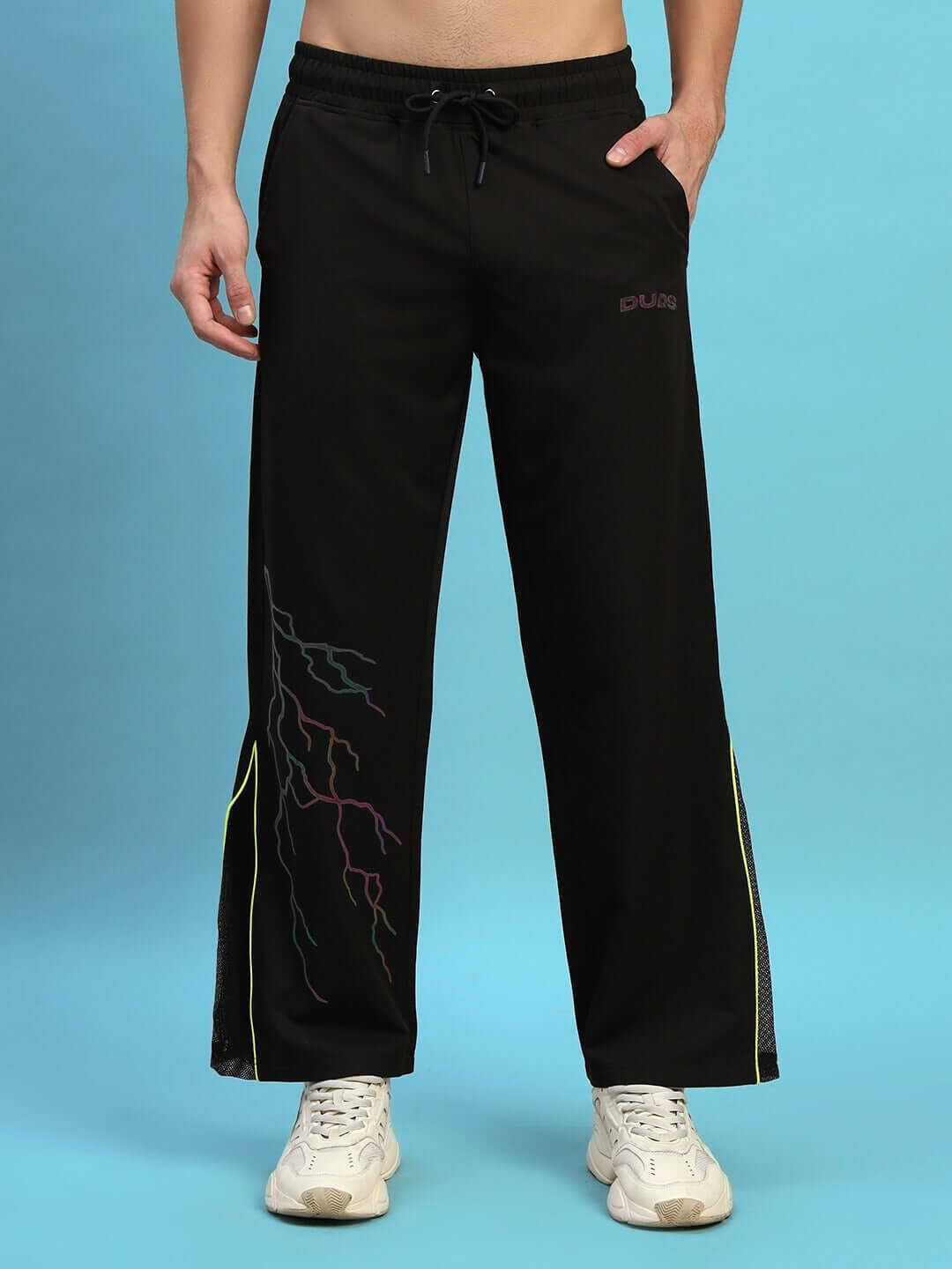 Person wearing black SALVO REFLECTOR RELAXED-FIT JOGGERS with colorful side detailing, suitable for custom fit options.