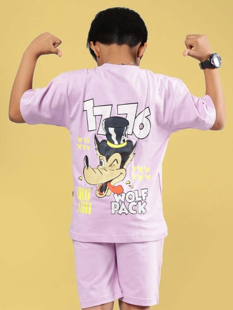 Child wearing lilac wolf pack t-shirt with cartoon graphic, flexing arms and standing against a yellow background.