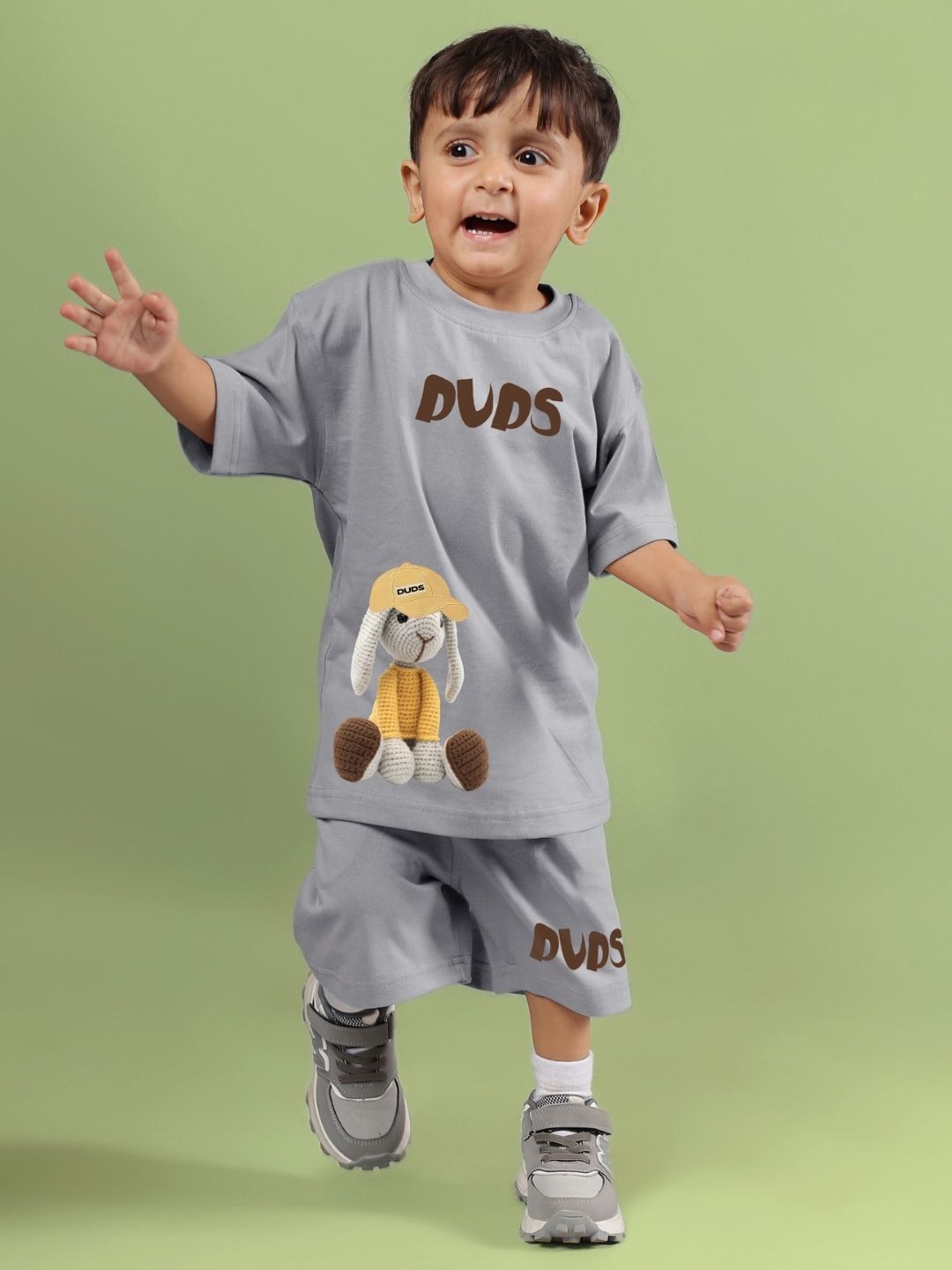 Child wearing grey Flint Bunny co-ord set with playful bunny design, suitable for boys and girls.