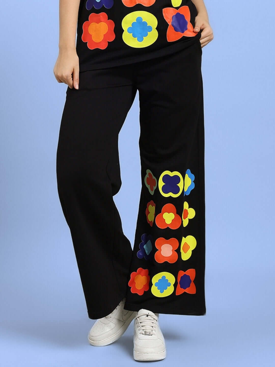 Black women's joggers with colorful floral pattern, part of the Hollister collection, tailored by DUDS.