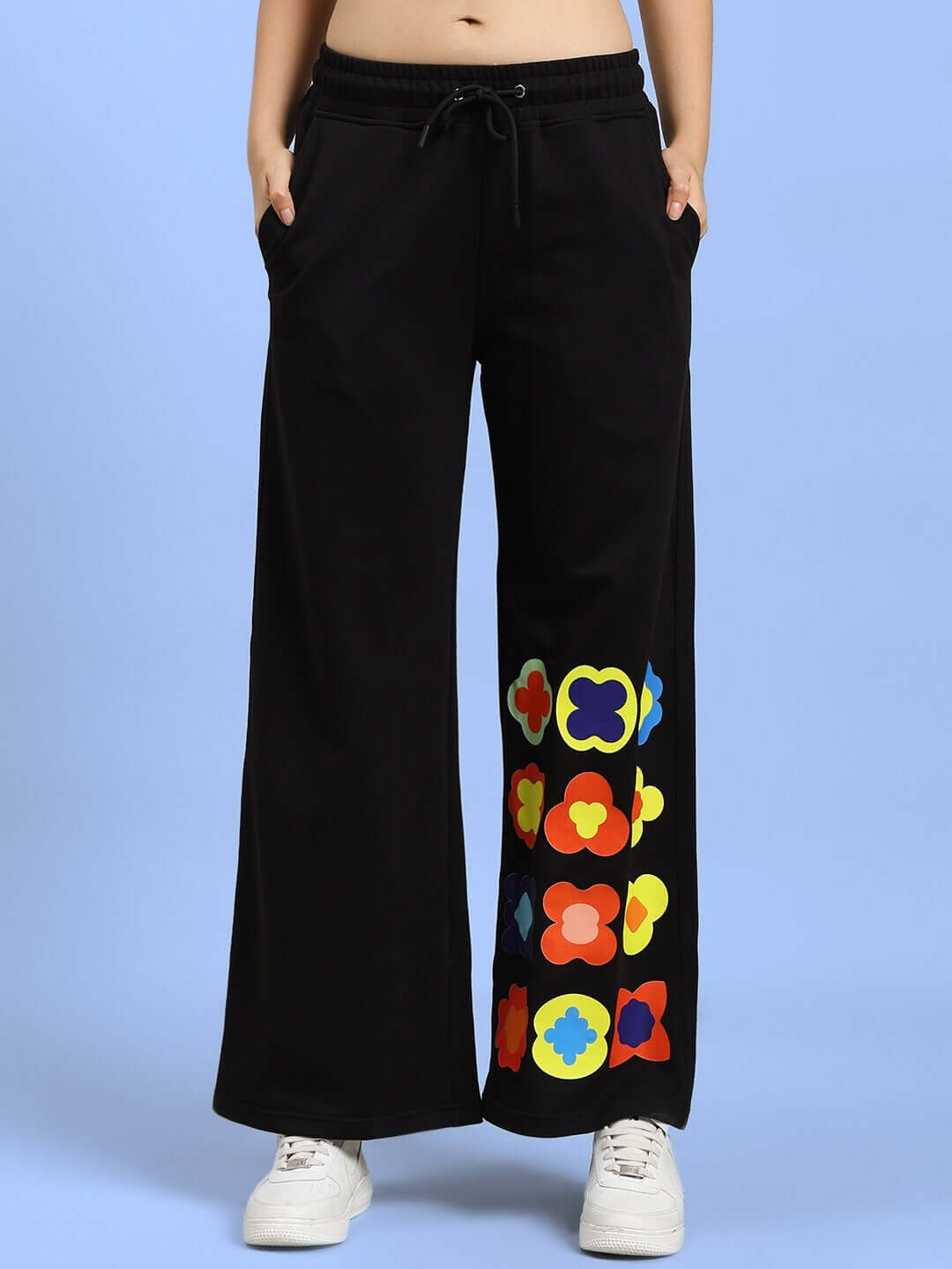 Black women's joggers with colorful floral design made by DUDS, customizable fit option available.