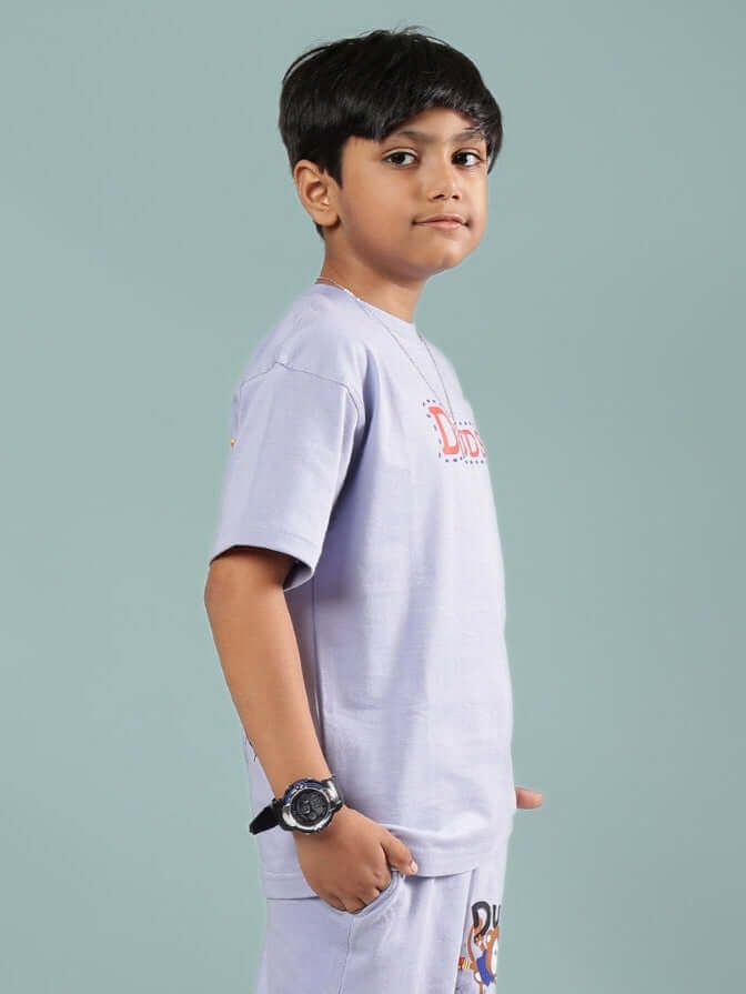 Child wearing lavender Sammy T-shirt for boys and girls by DUDS, side view, short sleeves, custom fit option available.