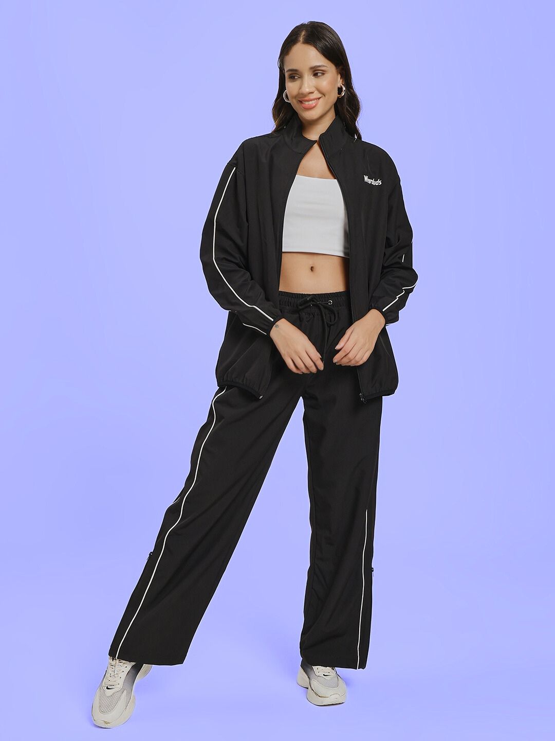 Model wearing WOMEN RELIGHT RELAXED FIT CO-ORD SET BLACK, showcasing stylish black loungewear with relaxed fit and minimal aesthetic.