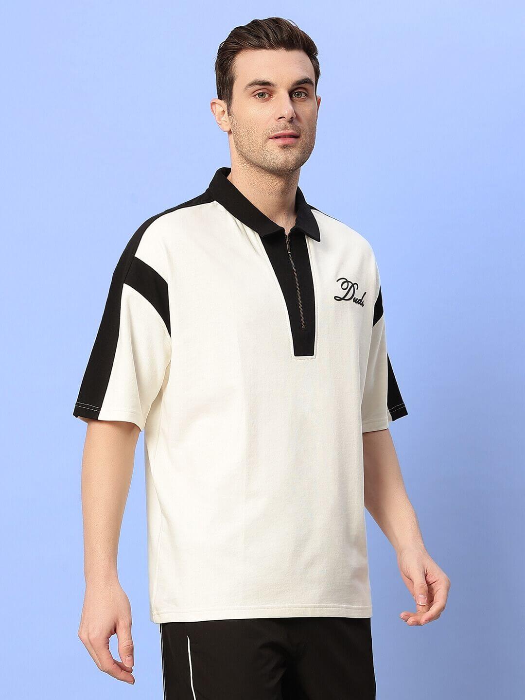 Model wearing MIKE POLO CLASSIC T-SHIRT in off-white, featuring premium cotton fabric with black accents, ideal for casual wear.