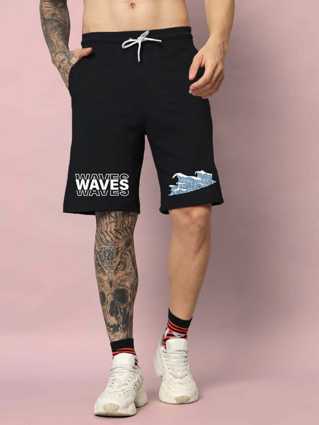 Man wearing black shorts with 3D wave design, showcasing style and comfort in premium cotton fabric, ideal for casual outings.