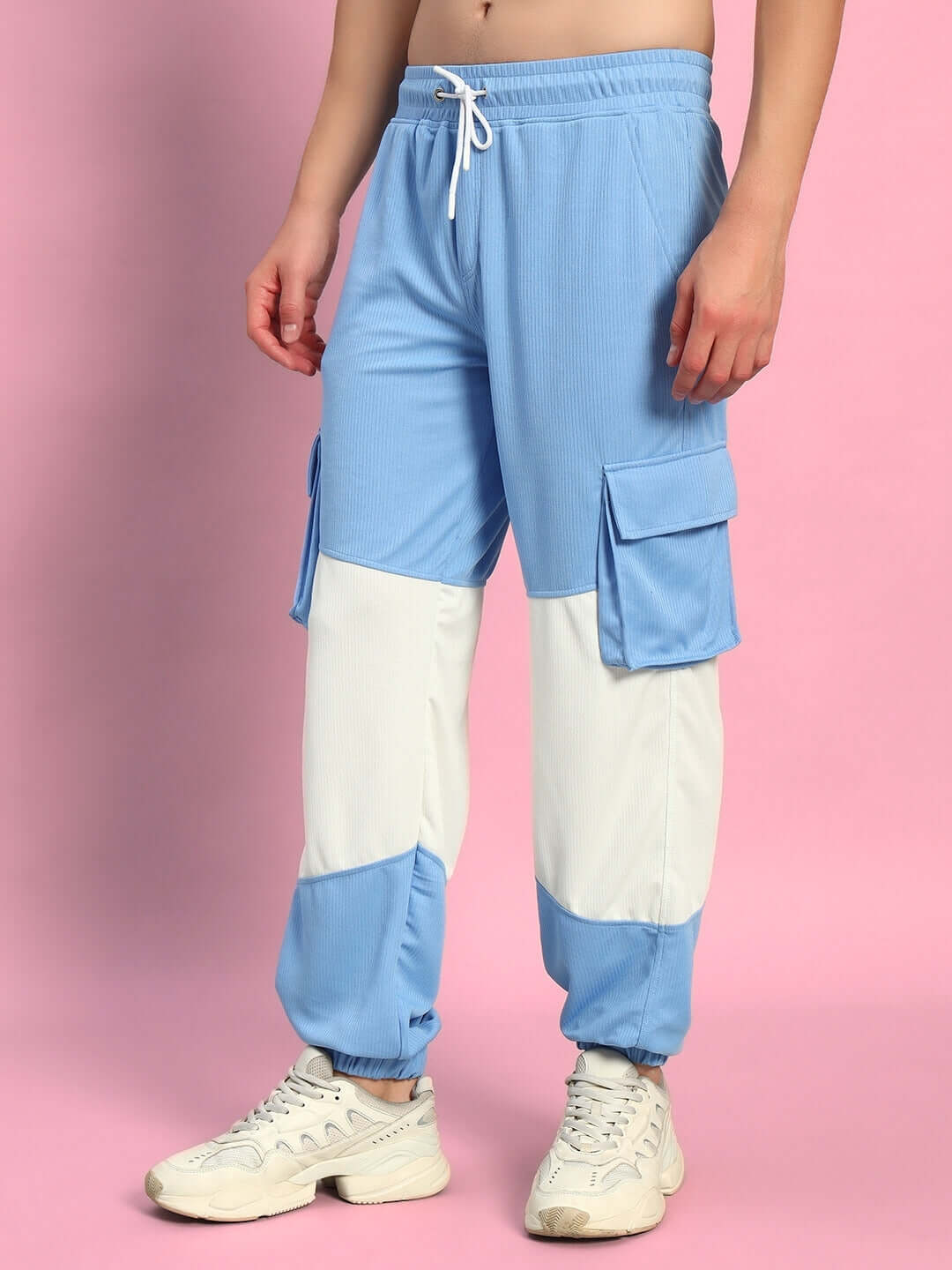 Person wearing Radiant Relaxed Fit Joggers in white and sky blue, showcasing style and comfort; ideal for custom fit options.