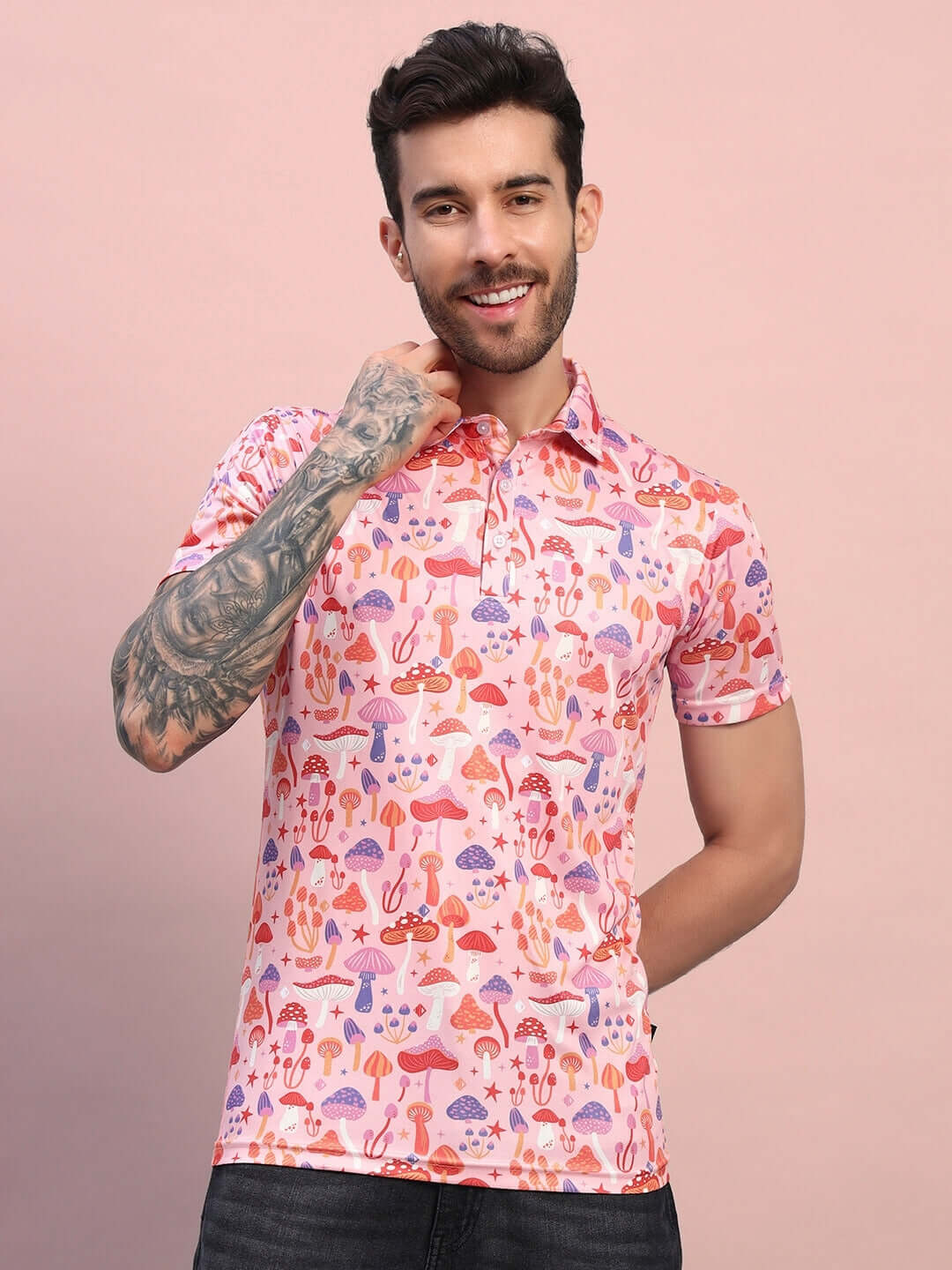 Man wearing Mushroom Print Regular Fit T-shirt in pink-multi sports polyester fabric, perfect for casual outings.