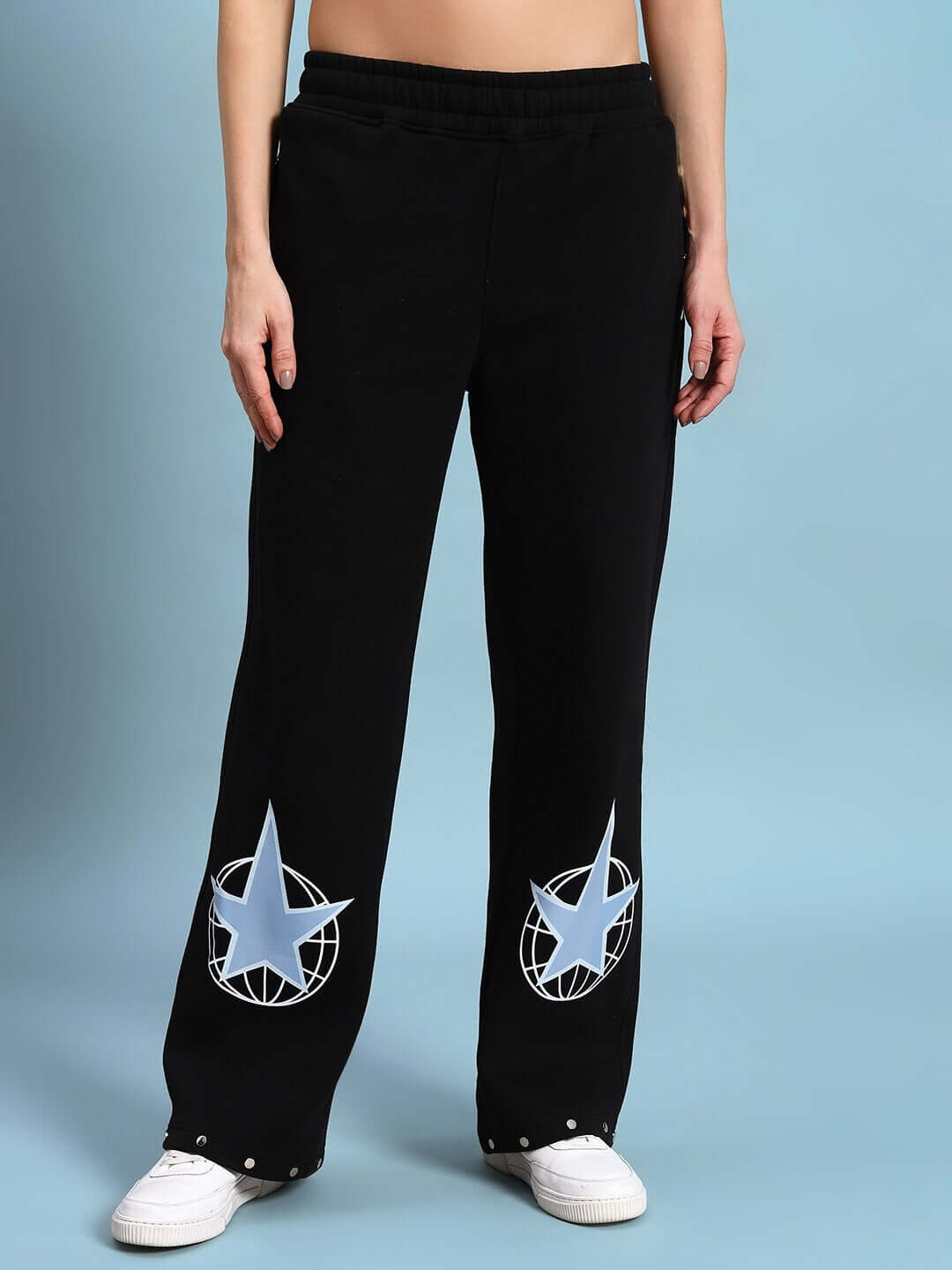 Women's Global Fleece Jogger in black with star design, offering warmth and style for cooler weather. Perfect for casual and lounge wear.