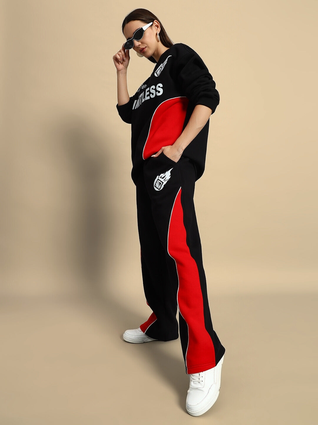 Woman wearing WD Fireball Colorblock Co-ord in black and red, showcasing streetwear style with soft, breathable fabric and relaxed fit.