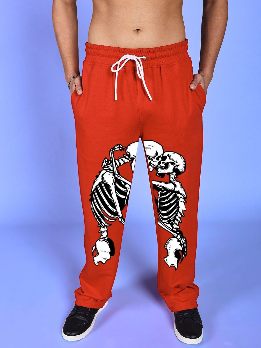 SKELETONS LOVE RELAXED FIT JOGGER RED featuring skeleton graphic on red joggers