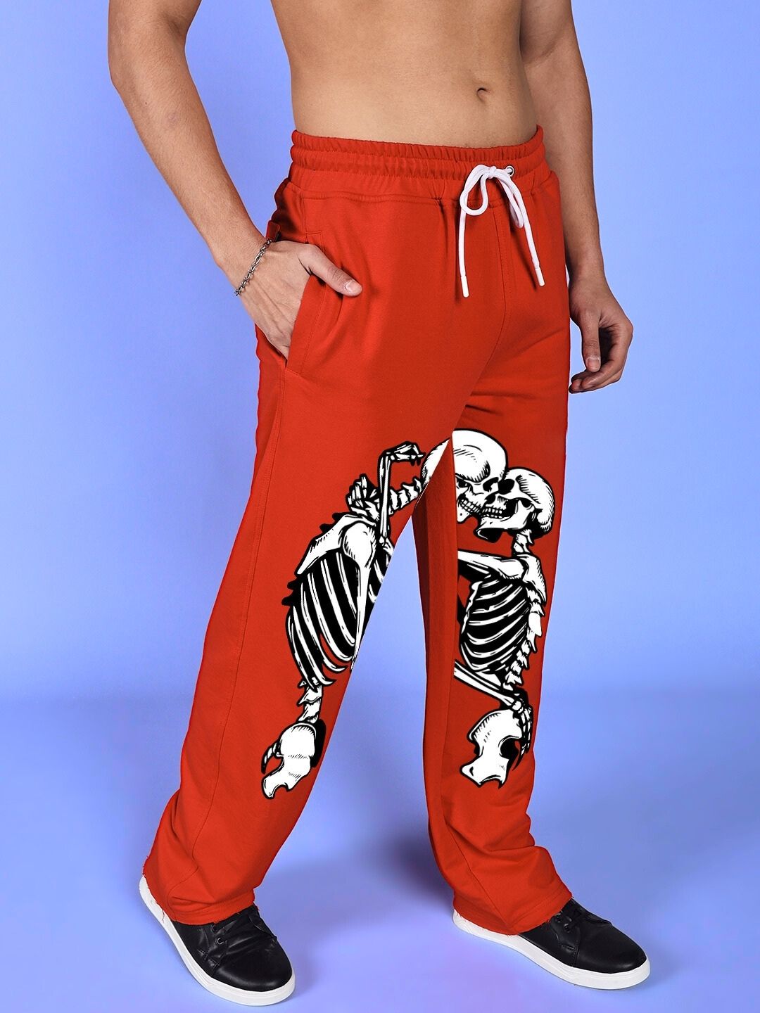 SKELETONS LOVE RELAXED FIT JOGGER RED with skeleton graphic design on red joggers perfect for casual style and comfort.