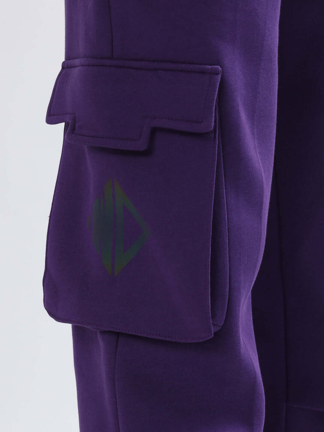 Close-up of purple 5 POCKET FLEECE SOLID CARGO PANT with visible pocket detail.