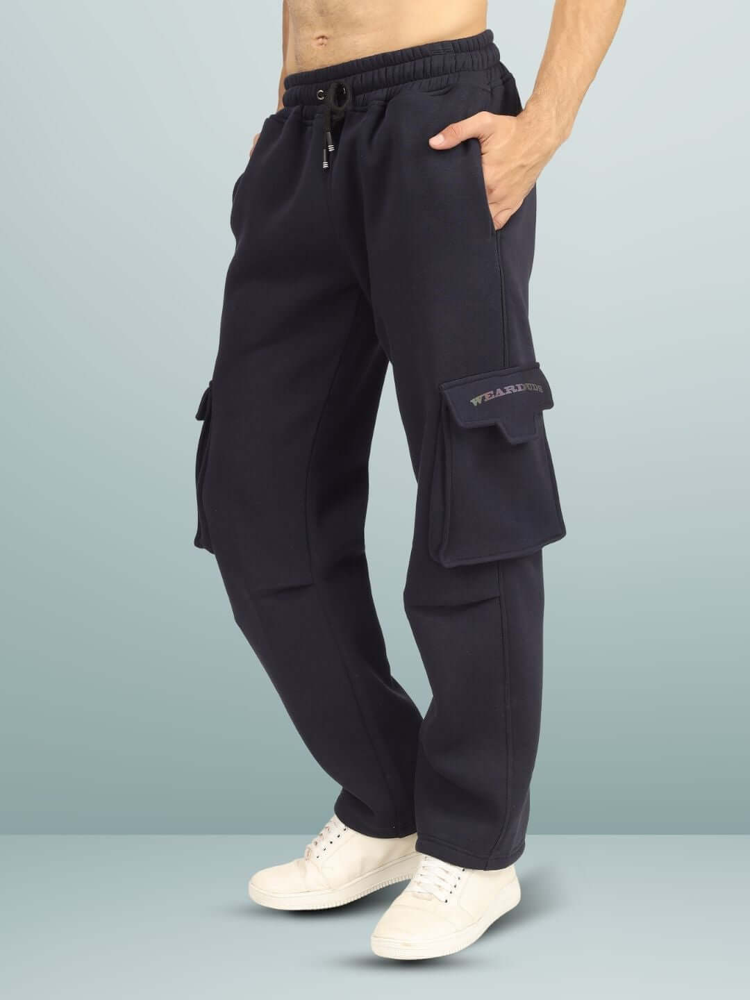 Person wearing 5 POCKET FLEECE SOLID CARGO PANT NAVY BLUE with white sneakers, showcasing streetwear style and comfort.