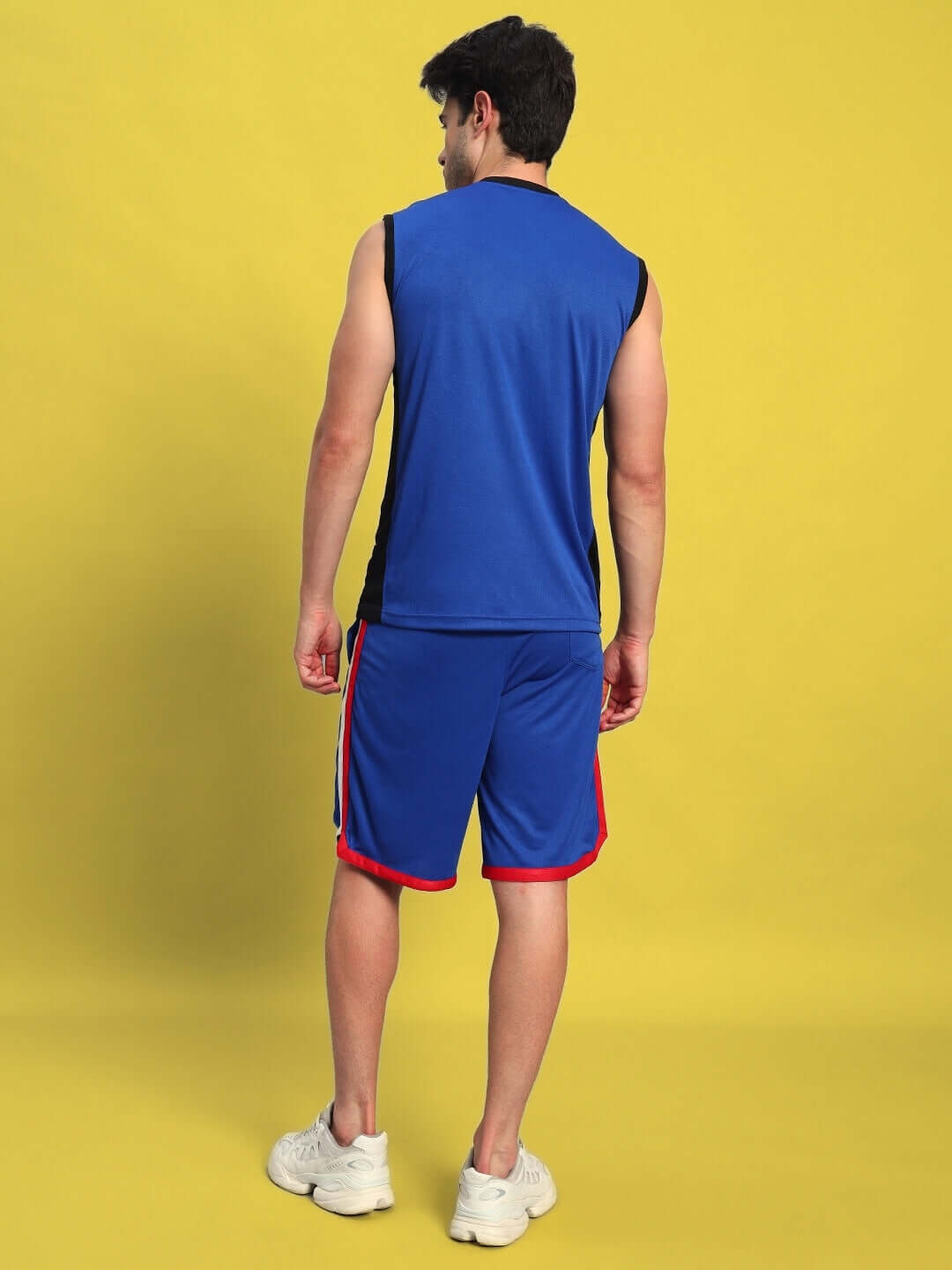 Man wearing PORTIA Gym Co-ord Set in Royal Blue, showcasing back view, sports polyester fabric, ideal for athletic wear.